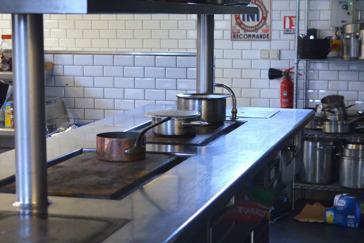Commercial kitchen breakroom with professional stainless steel appliance installation