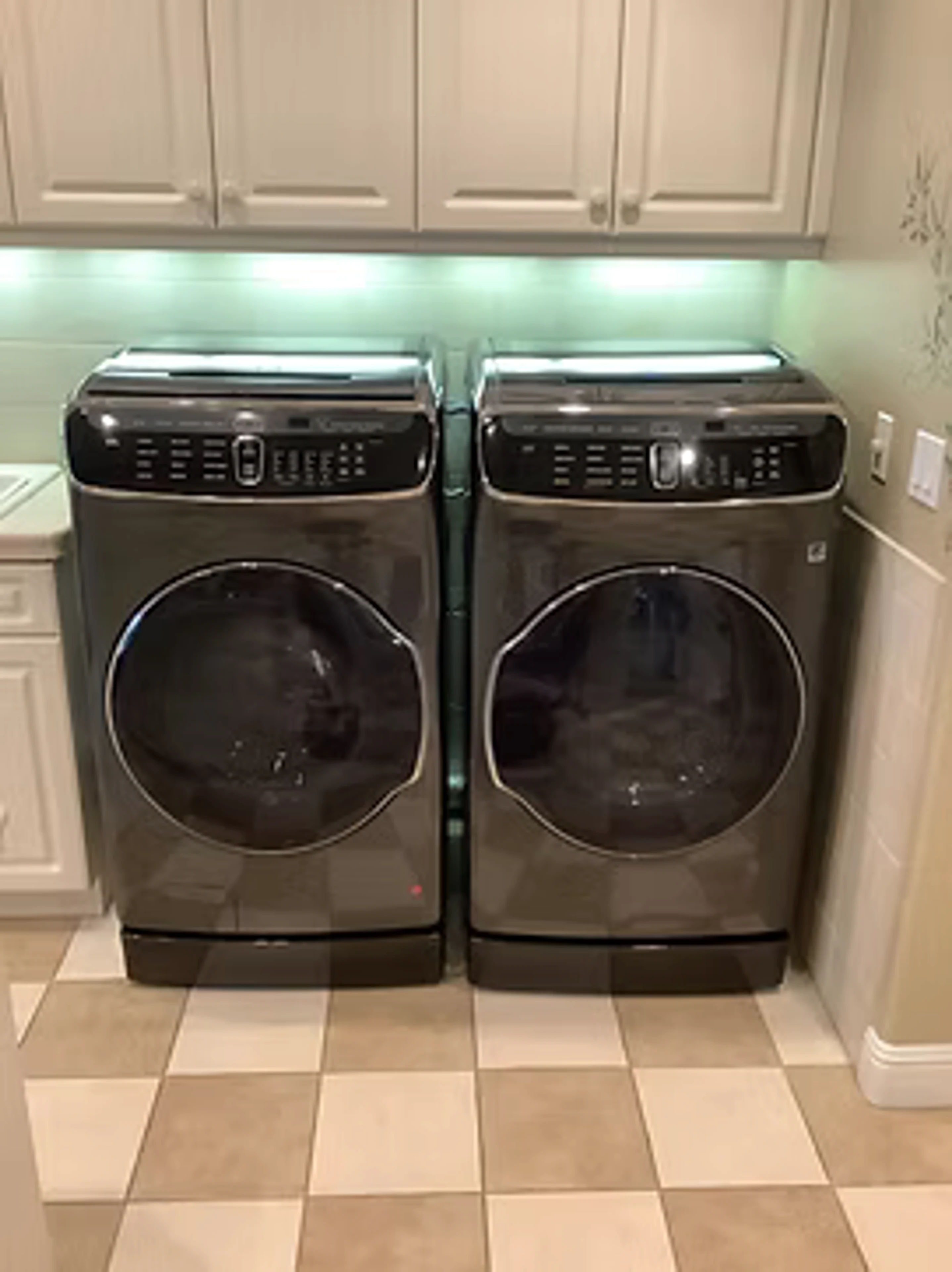 Washer and dryer installation in a laundry space