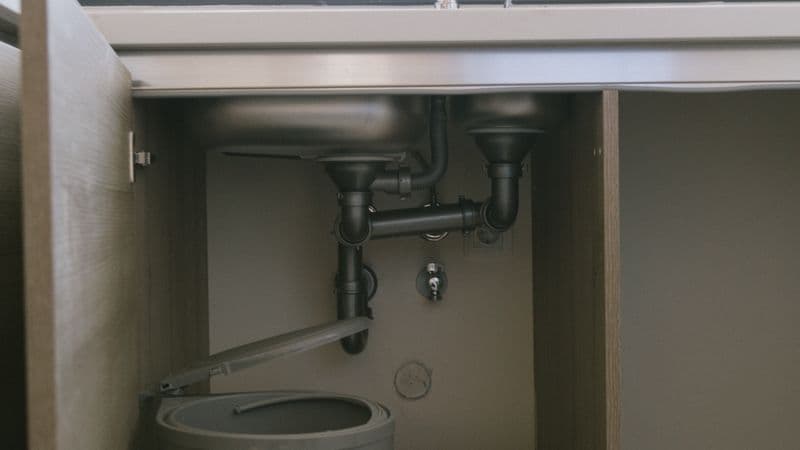 Garbage disposal installation under a kitchen sink