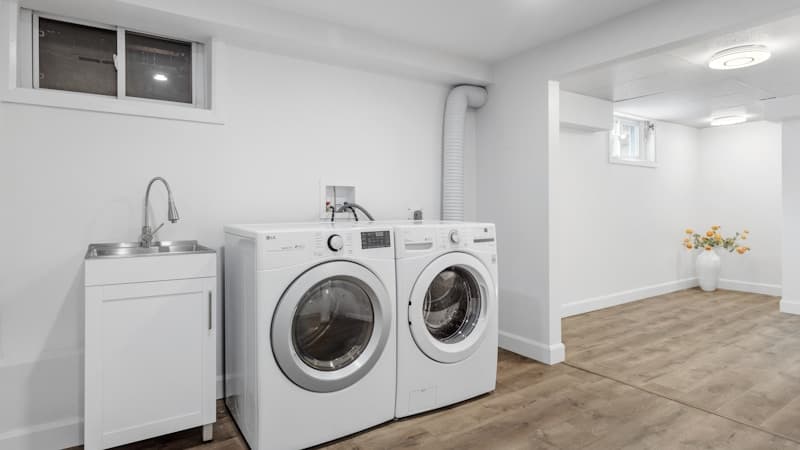 Clean washer and dryer pair installed in a laundry room