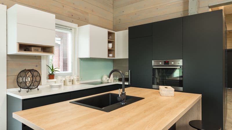 Built-in kitchen trash compactor installed under counter