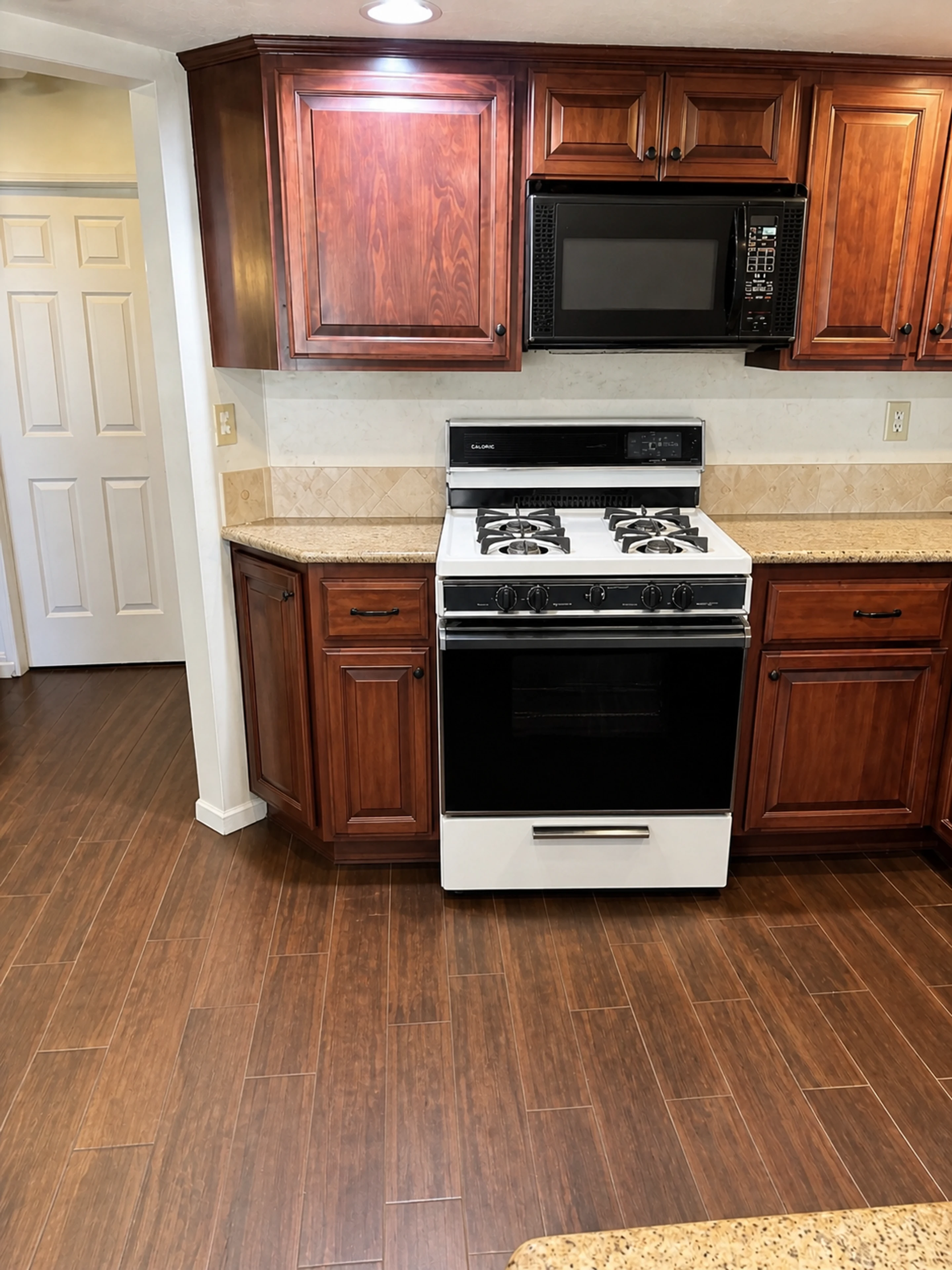 Freestanding range fitted between finished kitchen cabinets