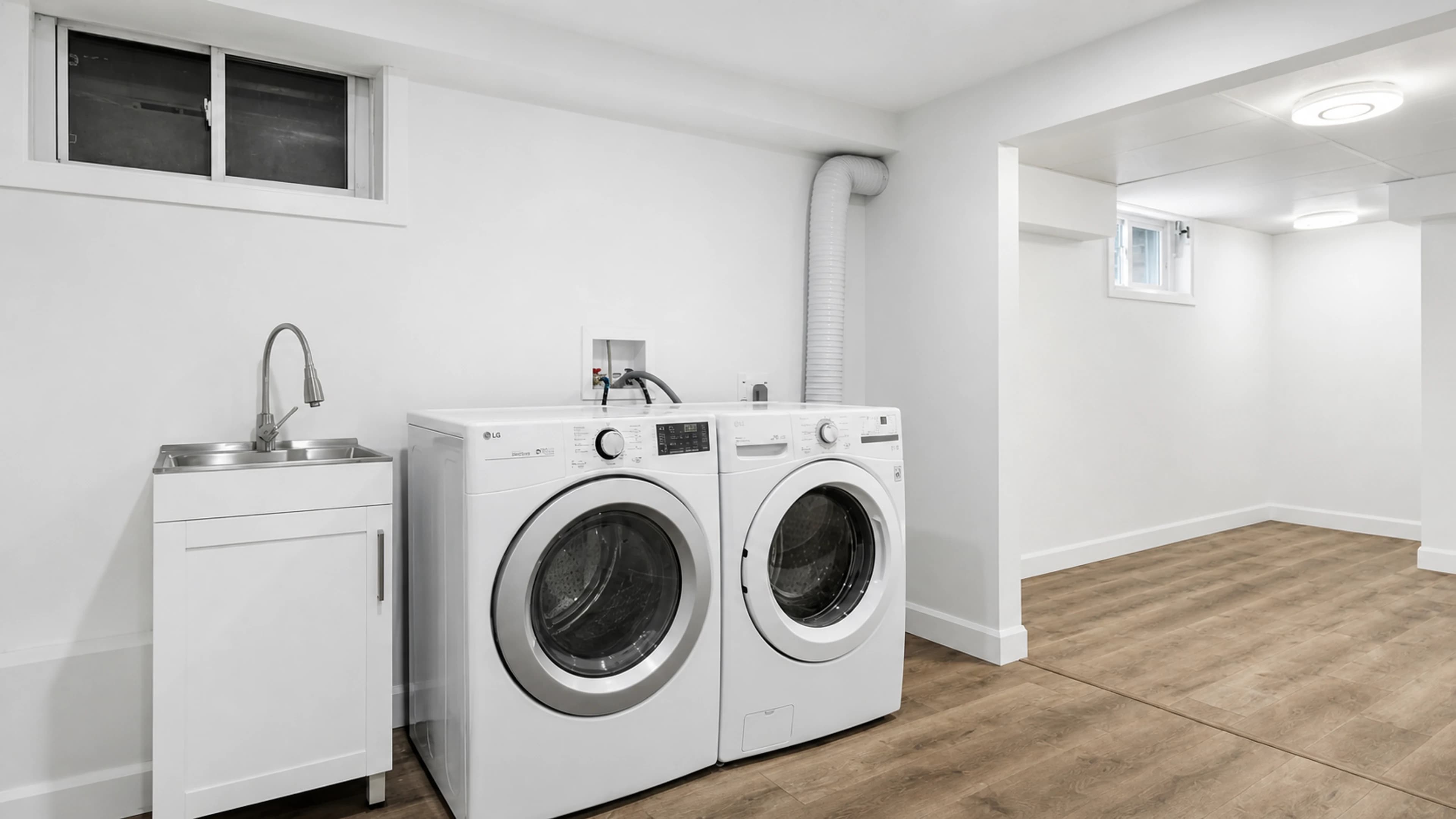Washer and dryer positioned in a finished laundry room
