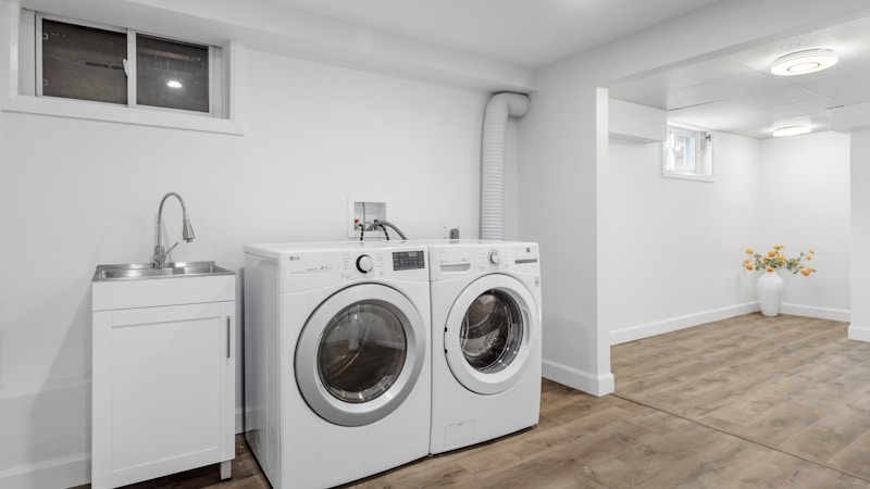Clean washer and dryer pair installed in a laundry room